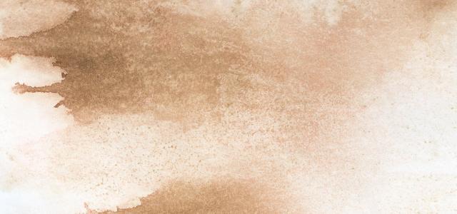 Beige watercolor painted background texture